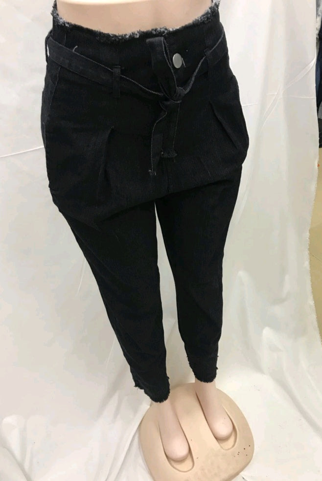 Woman wearing black high-waist stretch jeans
