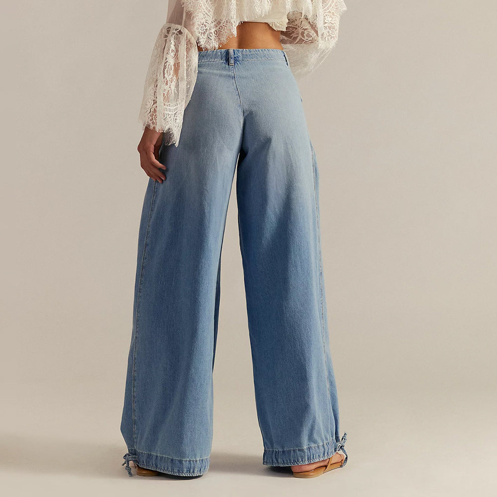 Back view of woman wearing light blue relaxed wide-leg jeans
