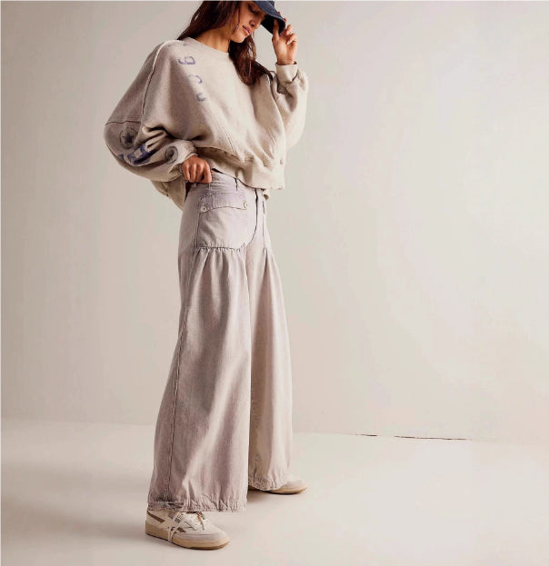 Woman wearing apricot relaxed wide-leg jeans in a casual outfit