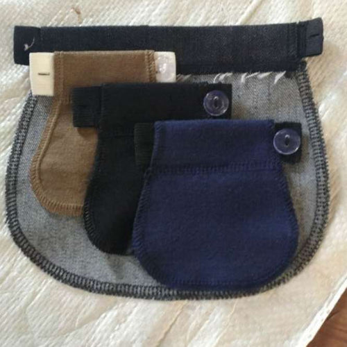 Black no-sew adjustable pants waistband extender attached to jeans