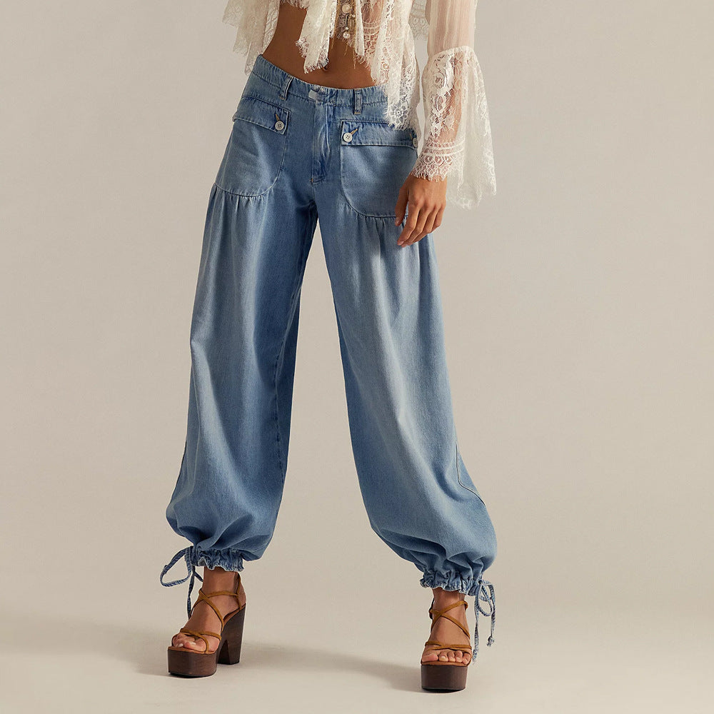 Woman wearing light blue relaxed denim jeans with elastic cuffs